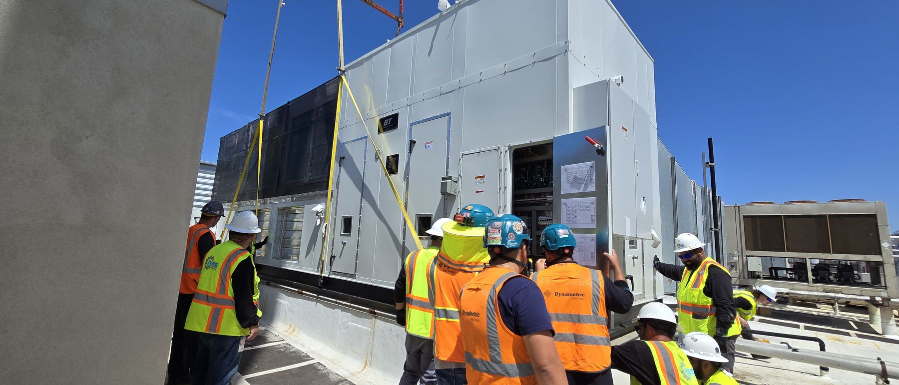 Project team reviewing a completed rooftop installation