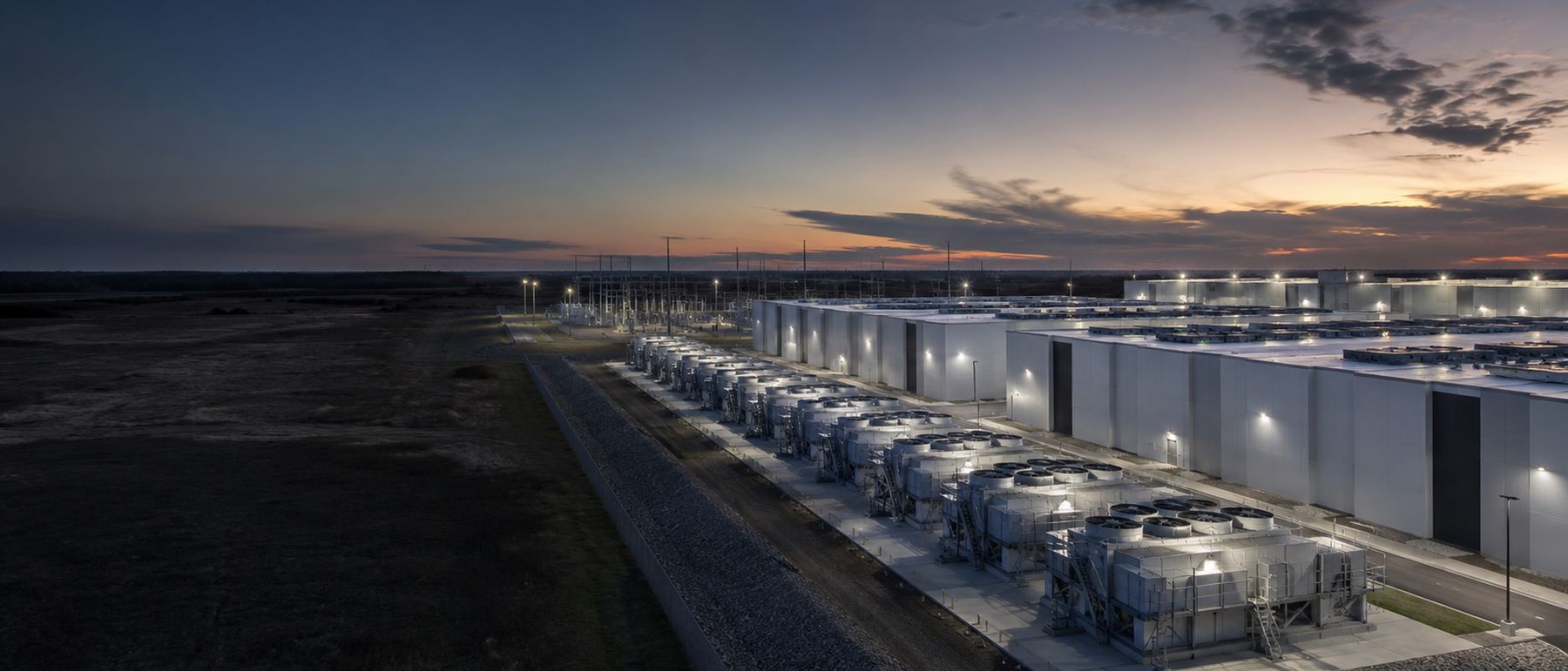 Rendering of modular cooling units running alongside a data hall at night