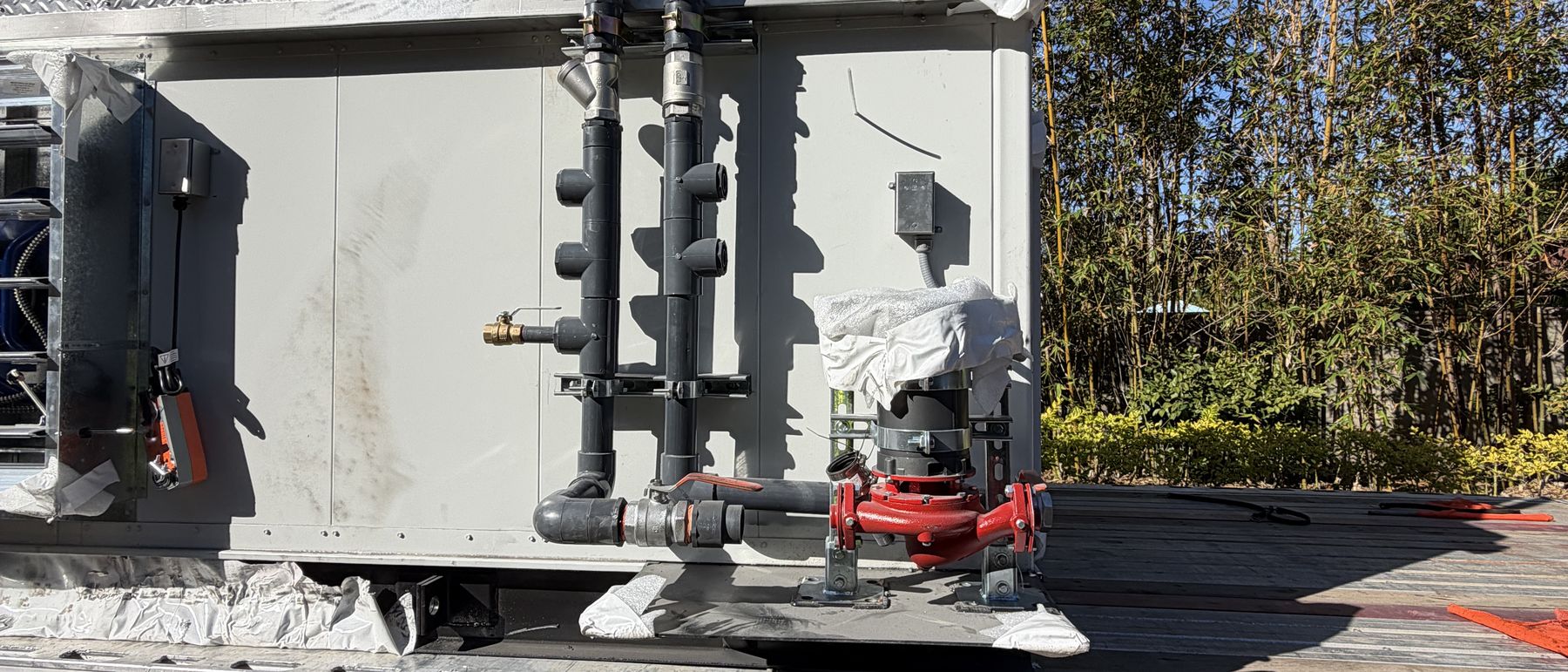 Factory piping and service connections on a hydronic unit