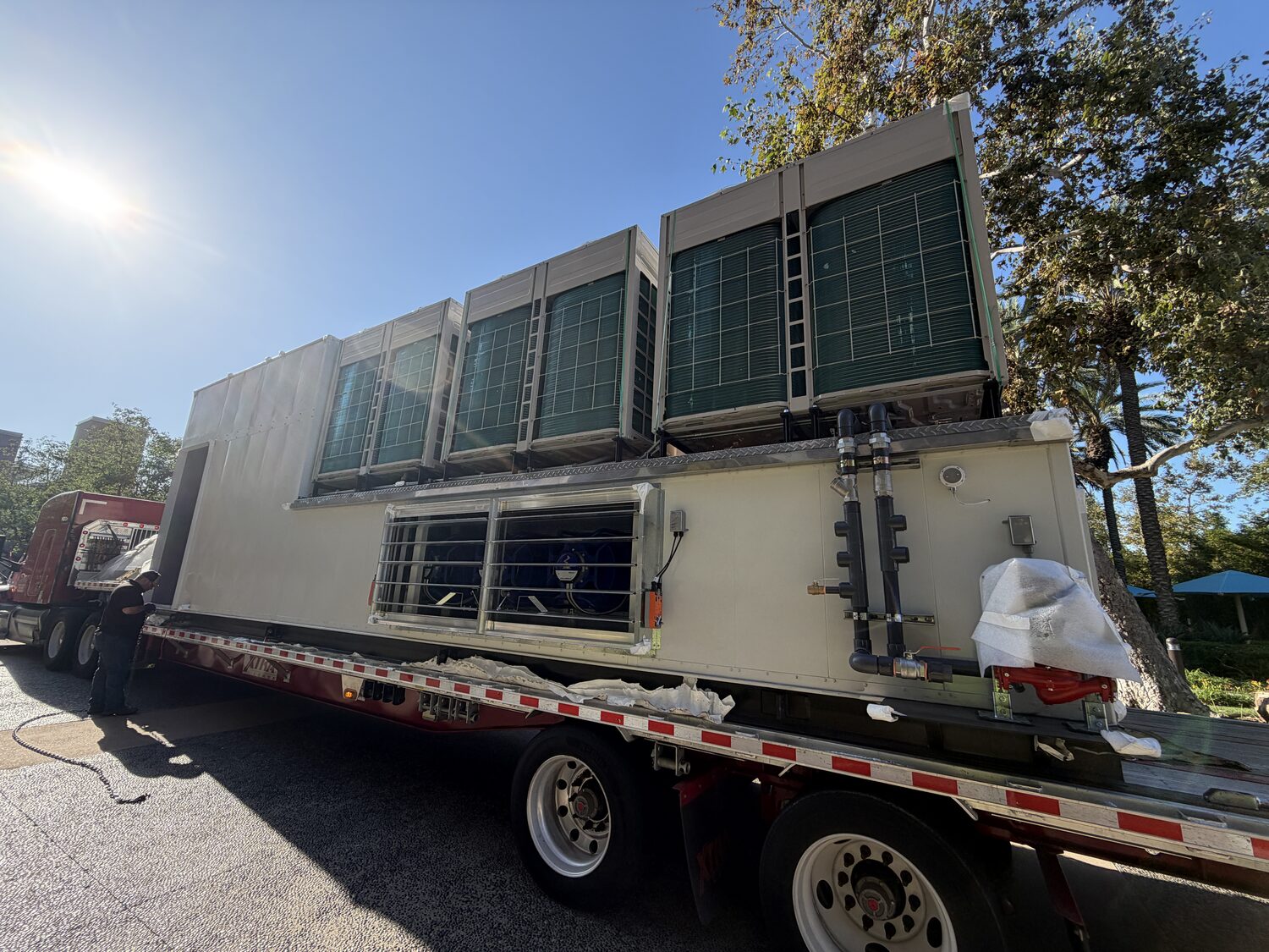 Packaged multi-zone replacement unit with factory-integrated controls in the assembly bay