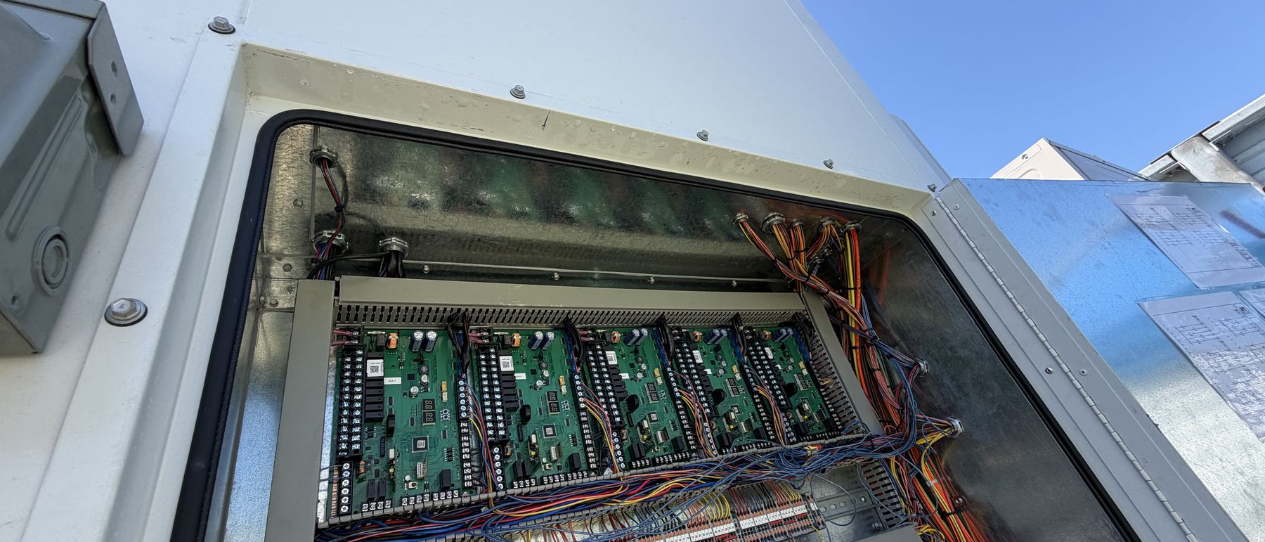 Factory-wired control panel with landed terminal blocks and labelled control boards